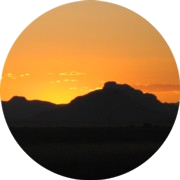 Camelback_Sunrise_C180 A sunset with mountains in the background.